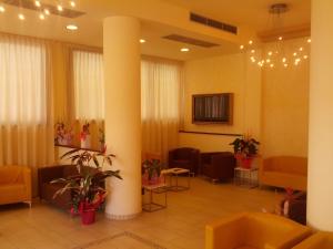 TV a/nebo společenská místnost v ubytování Hotel Abel & Residence