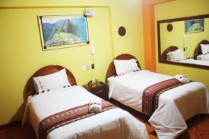 Katil atau katil-katil dalam bilik di Hotel Wayra