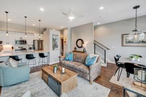 a living room with a couch and a table at New Luxury Loft #10 - Huge Hot Tub & Great Views - 500 Dollars Of FREE Activities & Equipment Rentals Daily in Winter Park