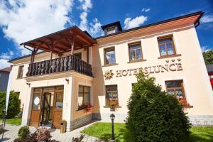 a building with a hotel survey sign on it at Hotel Slunce in Rýmařov