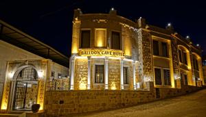 a building with a sign that reads education centre hotel at Balloon Cave Hotel in Goreme