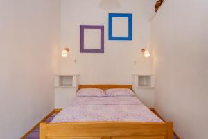 Postel nebo postele na pokoji v ubytování Apartments Kaštel