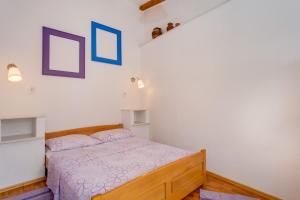 Postel nebo postele na pokoji v ubytování Apartments Kaštel