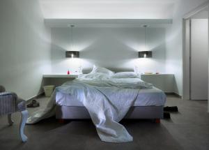Ein Bett oder Betten in einem Zimmer der Unterkunft Santa Maria Luxury Suites & Spa
