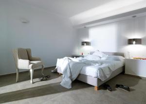 Ein Bett oder Betten in einem Zimmer der Unterkunft Santa Maria Luxury Suites & Spa