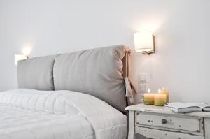 Ein Bett oder Betten in einem Zimmer der Unterkunft Santa Maria Luxury Suites & Spa