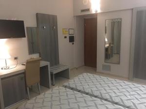 Postel nebo postele na pokoji v ubytování Hotel Niagara