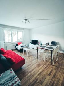 a living room with a couch and a table at 4P Apartment in Andermatt