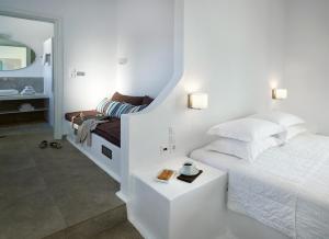 Ein Bett oder Betten in einem Zimmer der Unterkunft Santa Maria Luxury Suites & Spa