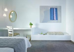 Ein Bett oder Betten in einem Zimmer der Unterkunft Santa Maria Luxury Suites & Spa