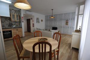 a kitchen and dining room with a table and chairs at Lagos Central Apartments Ap 1 in Lagos