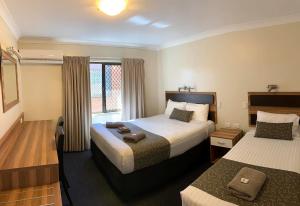 Postel nebo postele na pokoji v ubytování Charleville Motel