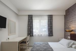 Voodi või voodid majutusasutuse Hotel Tamaris toas
