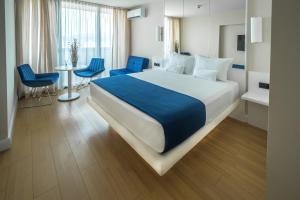Postel nebo postele na pokoji v ubytování Orbi City Hotel Official