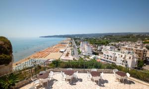 a view of the beach from the balcony of a building at Svevo Sea House in Vieste