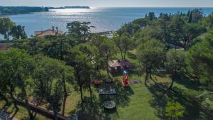 a scenic view of a park with trees and houses at Apartments Materada Residence in Poreč