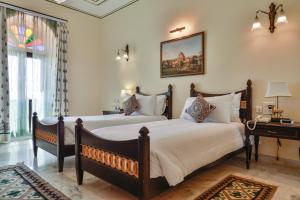 Postel nebo postele na pokoji v ubytování Hotel Jaisalkot