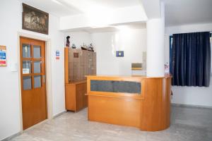 a courtroom with a wooden podium in a room at West End Hotel in Peyia