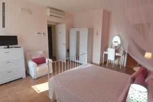 Ένα ή περισσότερα κρεβάτια σε δωμάτιο στο B&B Dimora Paolina