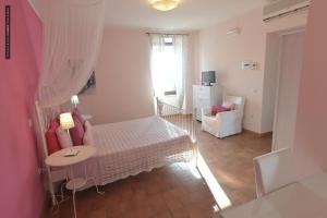 Ένα ή περισσότερα κρεβάτια σε δωμάτιο στο B&B Dimora Paolina