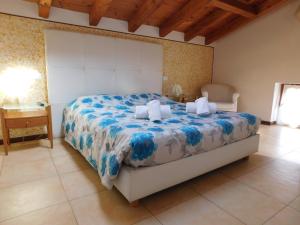 a bed with white sheets and a white bedspread at Locanda Ca'Orsa in Affi