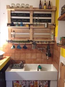a kitchen with a white sink in a room at Umbria In Bike B&B in Foligno