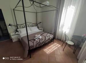 Łóżko lub łóżka w pokoju w obiekcie Villa Blanco's