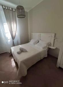 Łóżko lub łóżka w pokoju w obiekcie Villa Blanco's