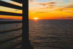 a sunset seen through the window of a cruise ship at Taliammari in Cefalù