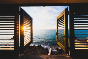 a view of the ocean from the windows of a building at Taliammari in Cefalù
