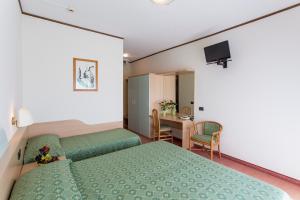 Postel nebo postele na pokoji v ubytování Hotel Europa