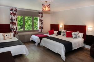 Ένα ή περισσότερα κρεβάτια σε δωμάτιο στο Hotel Palarine