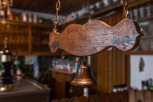 a bell hanging from a chain in a bar at Gasthaus Sponsel in Oberfellendorf