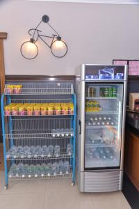 a refrigerator filled with lots of food and drinks at NICE STAY HOTEL in Raub