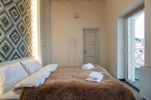 מיטה או מיטות בחדר ב-Шале БІЛИЙ ЛЕВ - WHITE LION Chalet