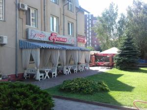 a group of tables and chairs outside of a building at Комплекс отдыха "Престиж" in Boryspil