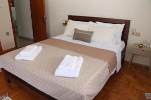 Postel nebo postele na pokoji v ubytování Meteoron Guesthouse