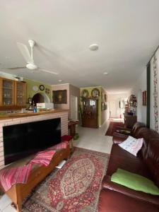 a living room with a couch and a fireplace at B&B Chardas in Bük