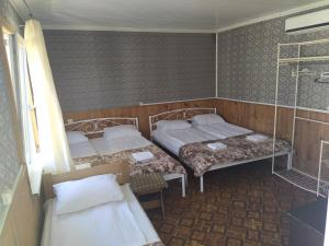 Postel nebo postele na pokoji v ubytování База відпочінку МегаПарус