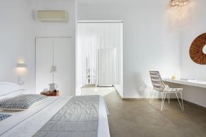 Ein Bett oder Betten in einem Zimmer der Unterkunft Santa Maria Luxury Suites & Spa