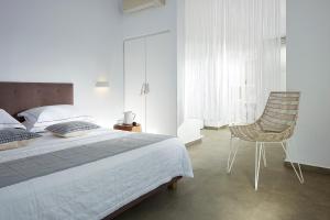 Ein Bett oder Betten in einem Zimmer der Unterkunft Santa Maria Luxury Suites & Spa