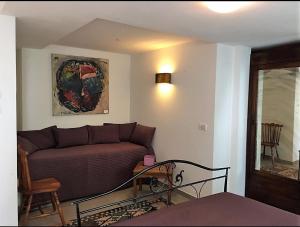 a living room with a couch and a table at AgriturismoB&B Loggia Degli Artisti in Palazzolo dello Stella