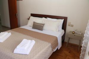 Postel nebo postele na pokoji v ubytování Meteoron Guesthouse