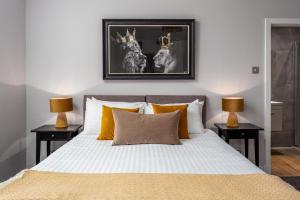 Ένα ή περισσότερα κρεβάτια σε δωμάτιο στο Seafield House - Donnini Apartments