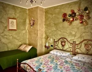 Ένα ή περισσότερα κρεβάτια σε δωμάτιο στο La Mammola Bed&Breakfast