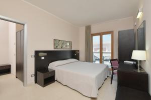 Postel nebo postele na pokoji v ubytování Hotel Mareluna