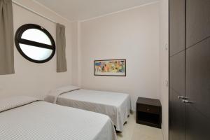 Postel nebo postele na pokoji v ubytování Hotel Mareluna