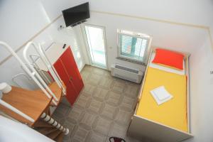 Postel nebo postele na pokoji v ubytování Apartmani Vila Caska