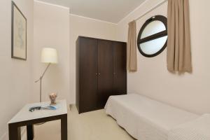 Postel nebo postele na pokoji v ubytování Hotel Mareluna