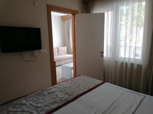 Postel nebo postele na pokoji v ubytování Trakya City Hotel